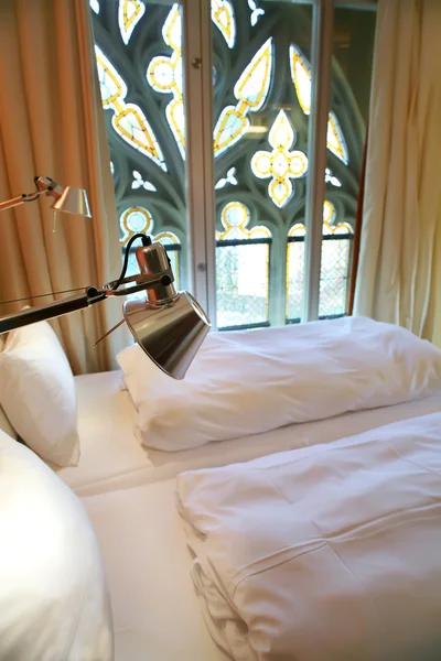Hotel room with gothic window — Stock Photo, Image