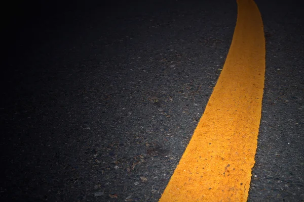 stock image Yellow lines on asphalt