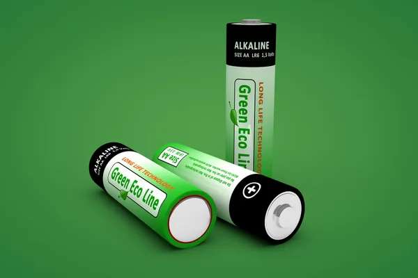 Three Modern Eco Batteries on Green — Stock Photo, Image