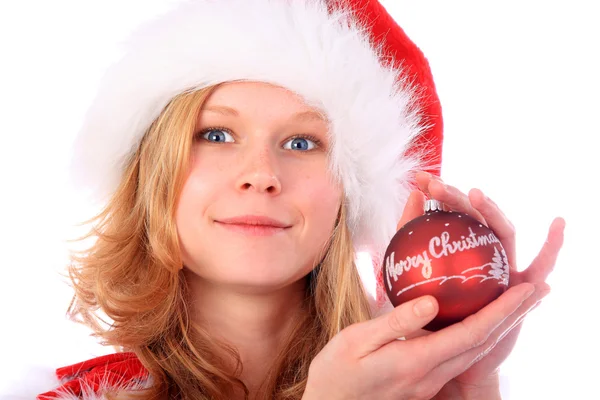 Mlle Santa tient une boule d'arbre de Noël rouge Image En Vente