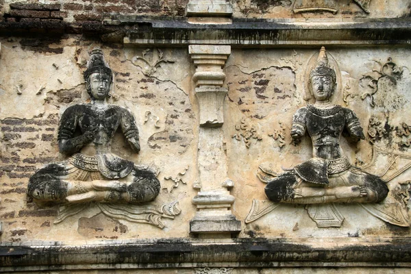 Buddhas an der Wand — Stockfoto
