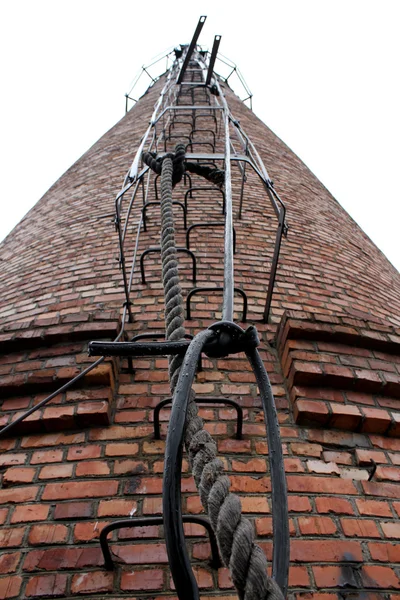 Rope and iron steps on the chimney — Stock Photo, Image