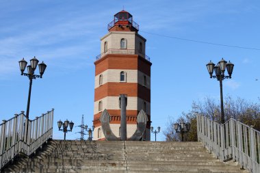 Memorial red brick light tower in Murmansk, Russia clipart