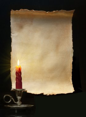 Vintage paper scroll lit a candle clipart