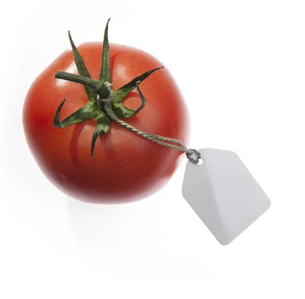 Beyaz arka plan üzerinde izole etiketi ile domates — Stok fotoğraf