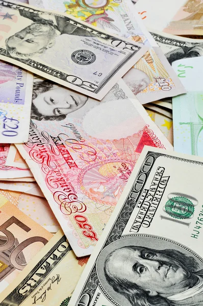 stock image Closeup of a pile of euro, dollar and pound