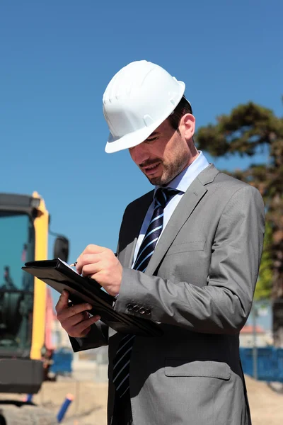 On building site with hardhat — Stock Photo, Image