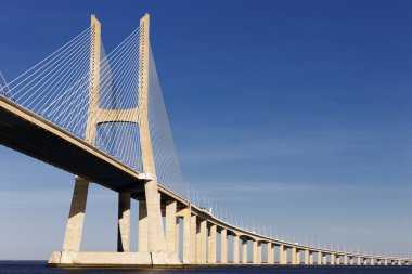 Vasco da Gama bridge in Lisbon in summer clipart