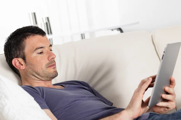 Tablet on sofa at home — Stock Photo, Image