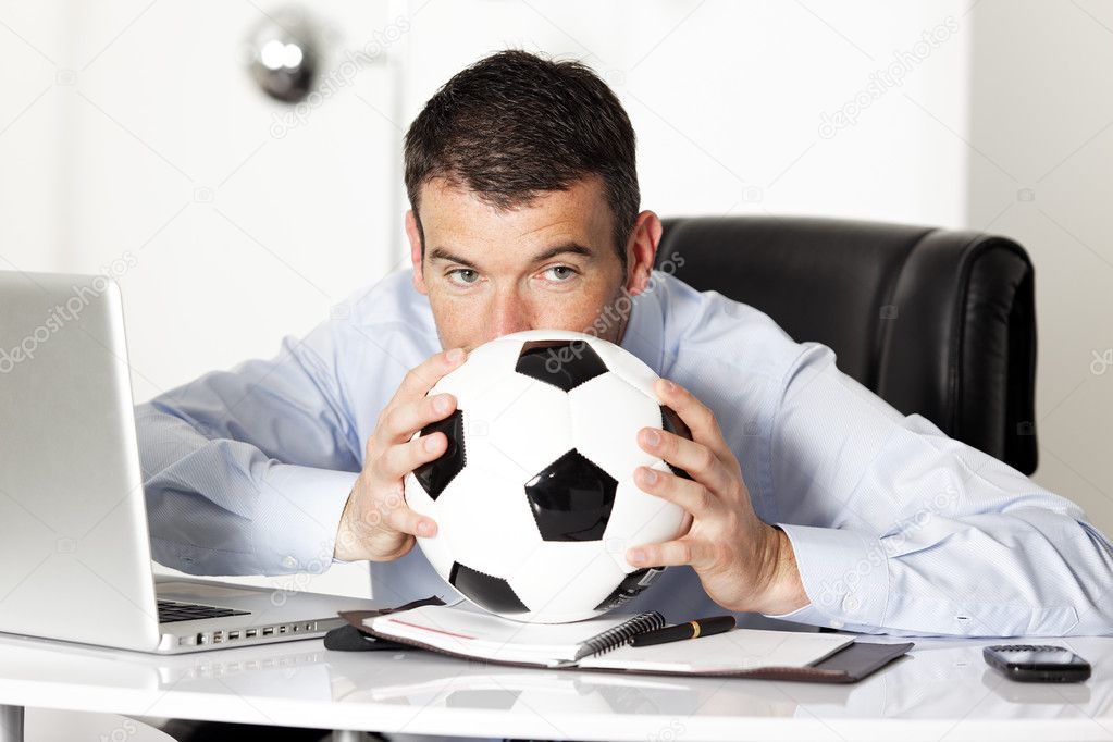 Man with ball in office