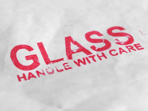 Glas handtag med omsorg — Stockfoto