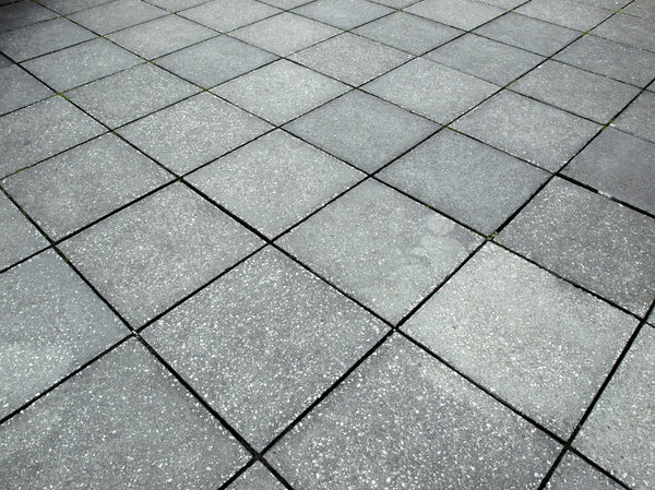 Detail of a concrete pavement with tiles