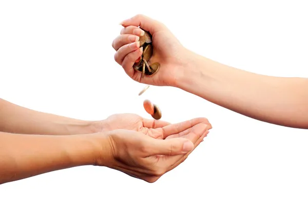 Female hand pour down coins into hands of another person — Stock Photo, Image