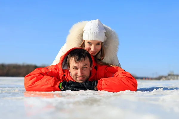 Portrait of young couple having fun on frozen river — Stock Photo, Image
