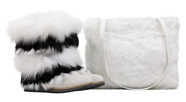 Women fur boots and fur shoulder bag over white — Stock Photo, Image