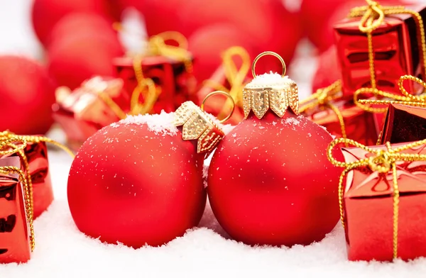 Christmas decorations on snow — Stock Photo, Image