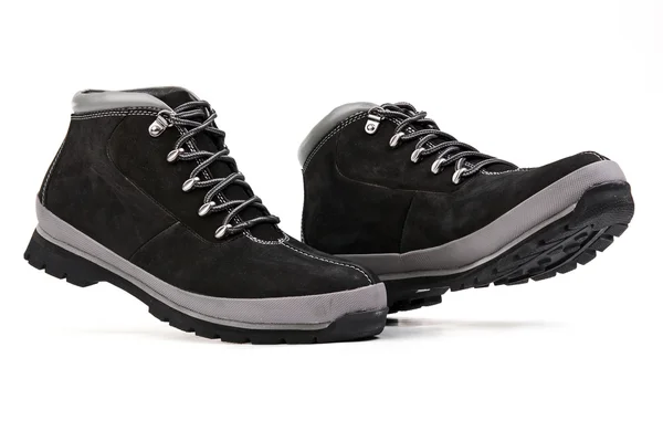 Low top men hiking boots over white — Stok fotoğraf