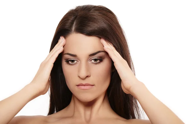 stock image Woman rubbing forehead