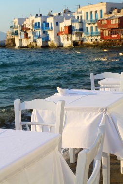 Restaurant near the sea at Little Venice on the island of Mykonos in Greece clipart