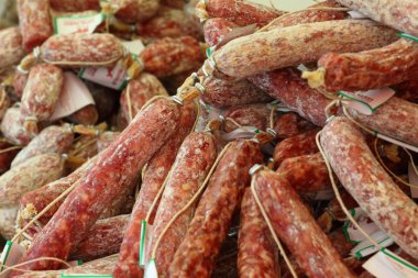 Traditional Italian sausages on display at farmer's market clipart