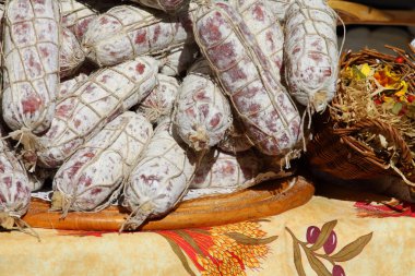 Traditional Italian sausages on display at farmer's market clipart