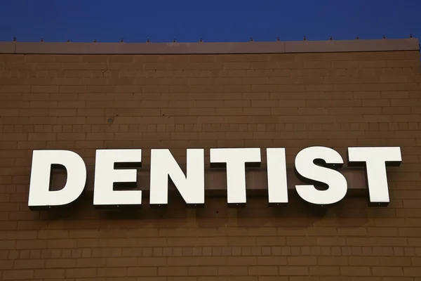 stock image Dentist sign on the brick wall