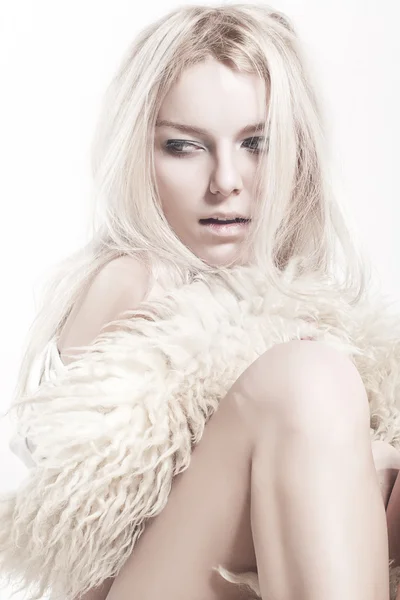 Sexual blonde posing in furs — Stock Photo, Image