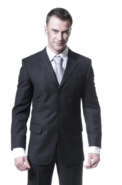 Joven hombre de negocios guapo en traje negro y corbata gris — Foto de Stock