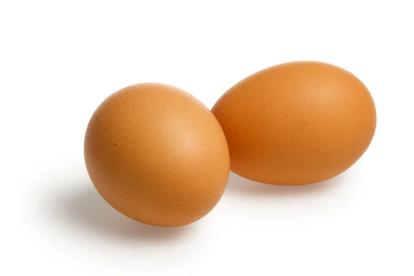 Dvě hnědá vejce s ořezovou cestou — Stock fotografie