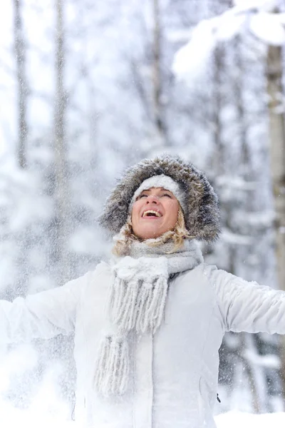 Happy young woman in in snowy forest — Stock Photo, Image