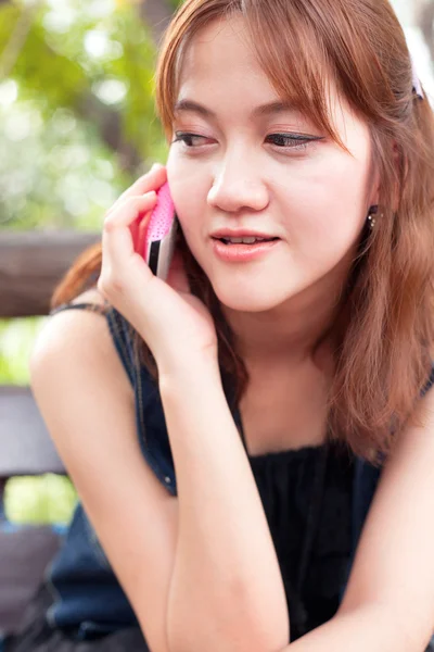 Women are talking about the phone. Stock Photo
