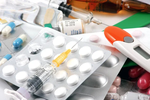 stock image Pills of many shapes and colors grouped together