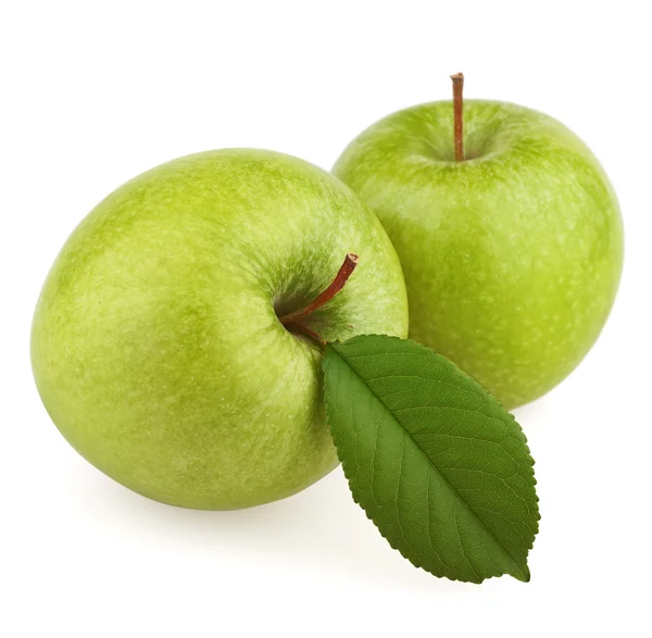 Два зеленых яблока с листом — стоковое фото