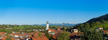 Panoramic view above the roofs of Pfronten im Allgaeu clipart