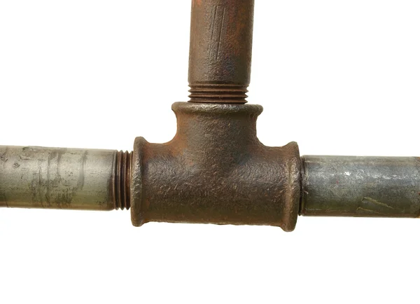 A fragment of the old water conduit consisting of pipes and fitt — Stock Photo, Image