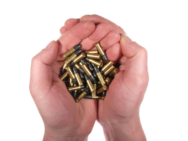 Handful of bullets isolated on white.