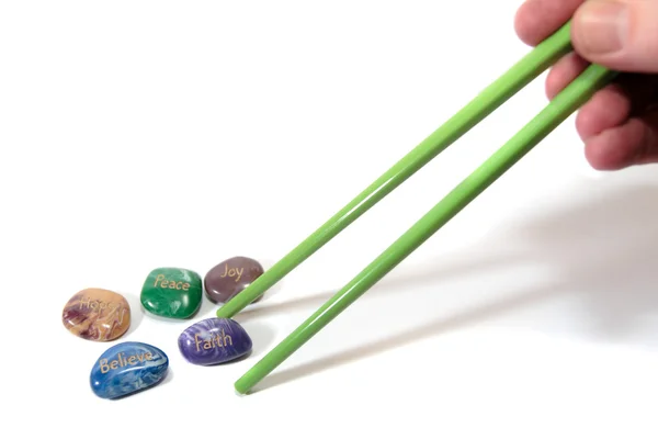 Five affirmation stones and chopsticks — Stock Photo, Image