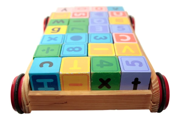 Childrens play letter blocks in cart — Stock Photo, Image