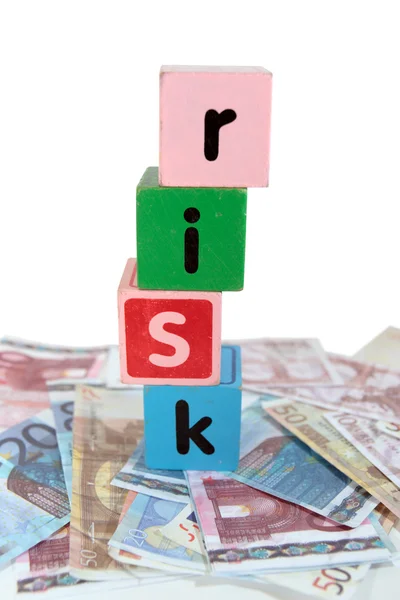 Peněžní riziko v hračky hrát hůlkovým písmem — Stock fotografie