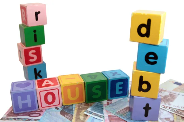 おもちゃの家債務のリスク再生ブロックの手紙 — ストック写真