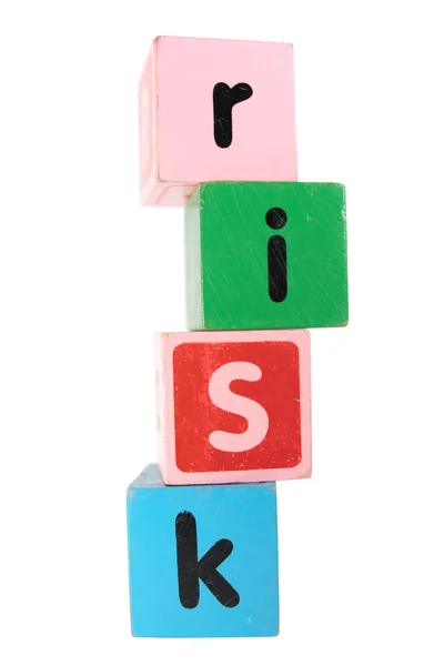 Riziko v hračky hrát hůlkovým písmem — Stock fotografie