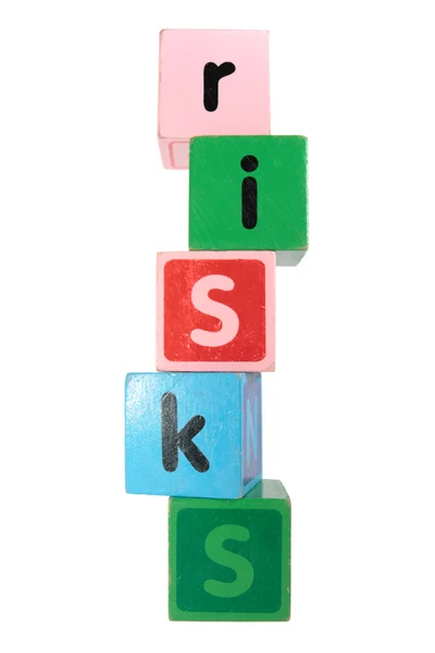 Risks in toy play block letters — Stock Photo, Image