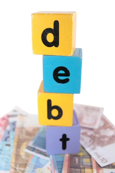 Ευρώ μετρητά χρέους με γράμματα παιχνίδι — Φωτογραφία Αρχείου