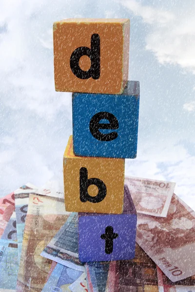 Stormy debt in play letters — Stock Photo, Image