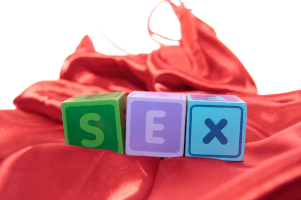 stock image Blocks spell sex on silk nightie