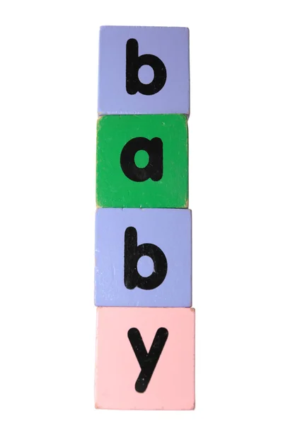 Дитина в іграшці грає блочні літери з відсічним контуром на білому — стокове фото