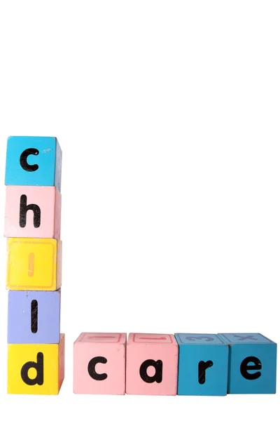 Guardería deletreado en juguete jugar letras de bloque con recorte camino — Foto de Stock