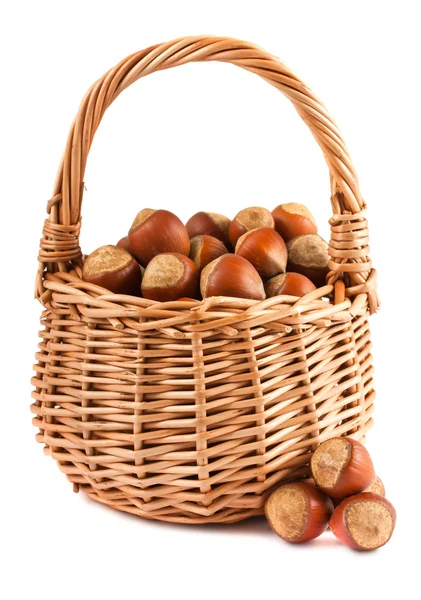 Wicker basket with hazelnuts — Stock Photo, Image