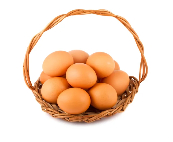 stock image Chicken eggs on wicker basket