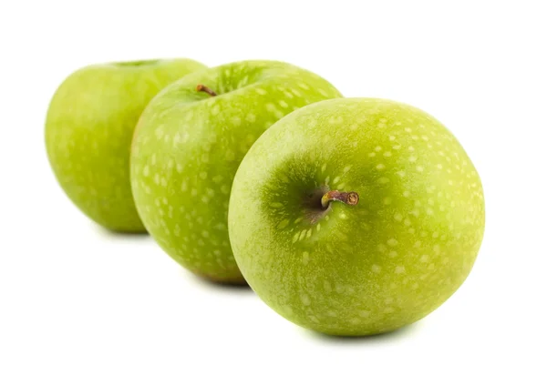 Groene appels op een witte achtergrond — Stockfoto